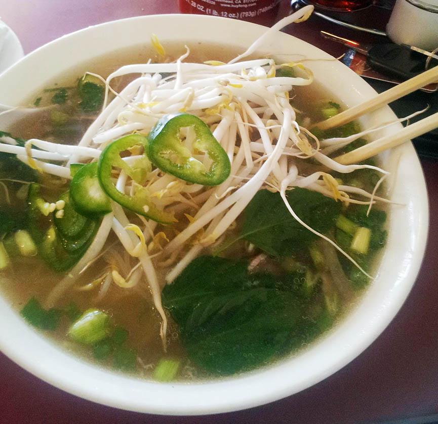 A steaming bowl of pho at Com Com Restaurant